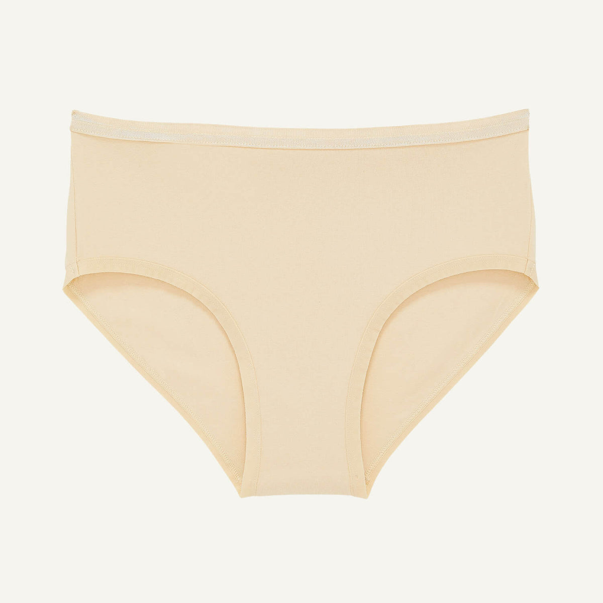 A mid rise brief in wheat beige color.