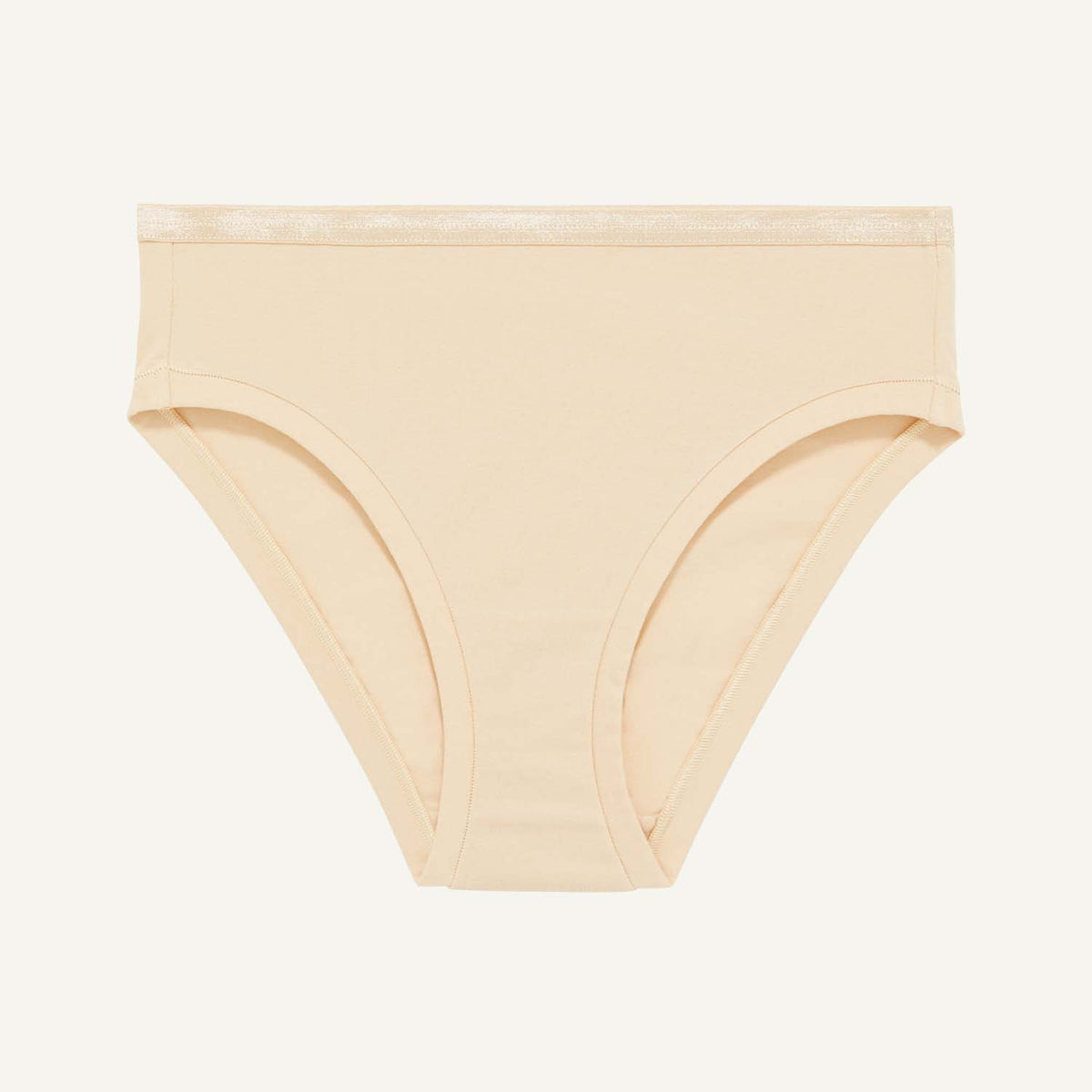 A mid rise bikini in wheat beige color.