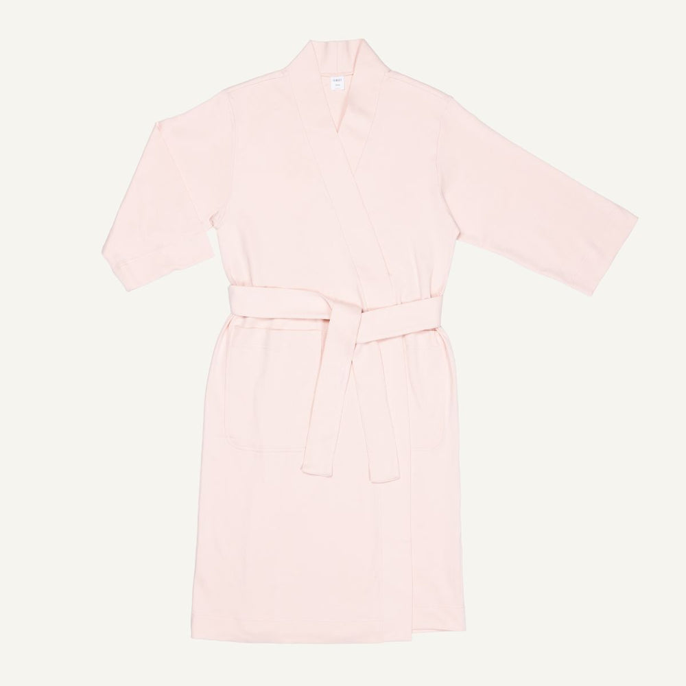 A light pink quartz organic cotton essential robe with 3/4 sleeves and a half-calf length.