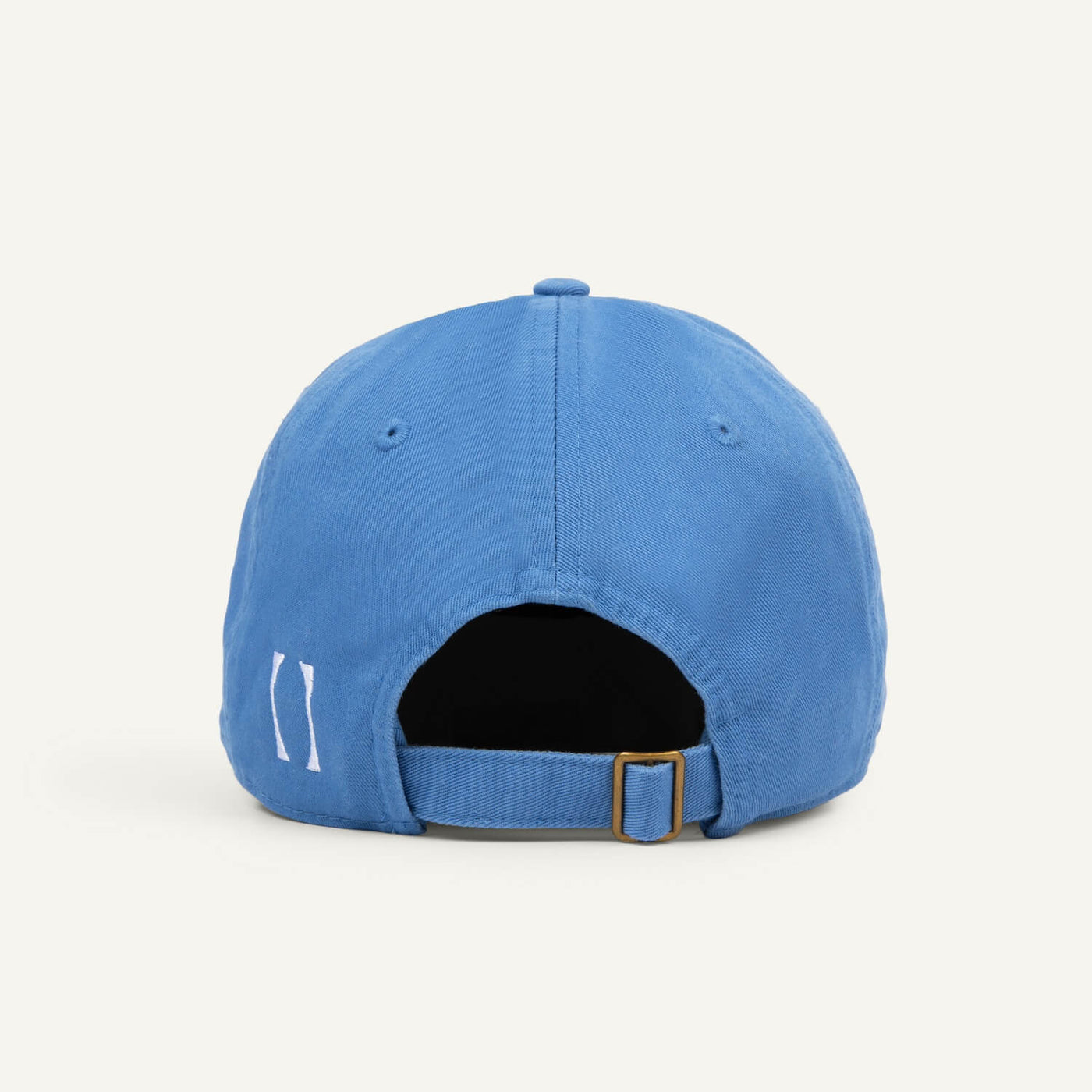 A blue organic cotton hat photographed from the back